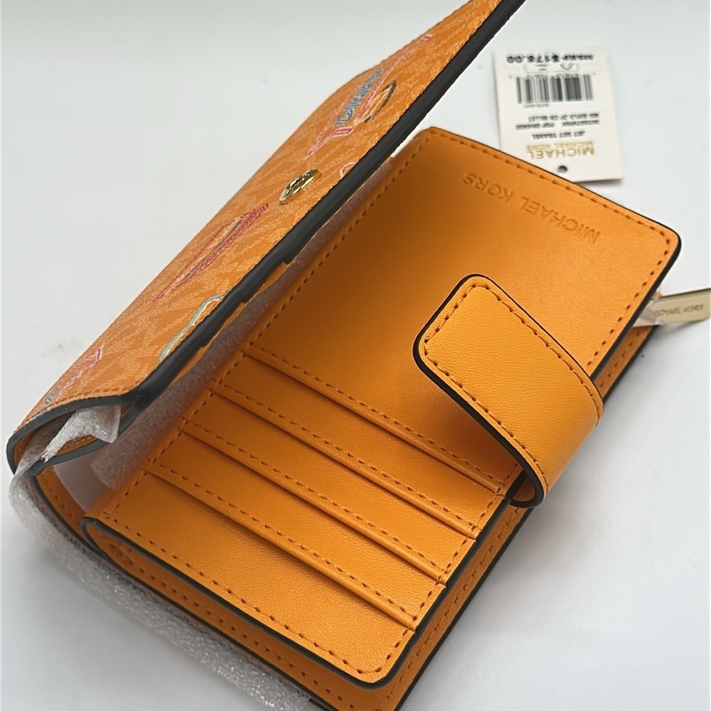 Michael Kors Jet Set Travel Medium Printed Signature Logo Bi-Fold 
Pop Orange - Picture 11 of 14